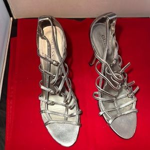 Guess by Marciano silver leather sandals.